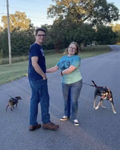 Man and woman with two dogs.