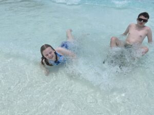 Two children in a pool.