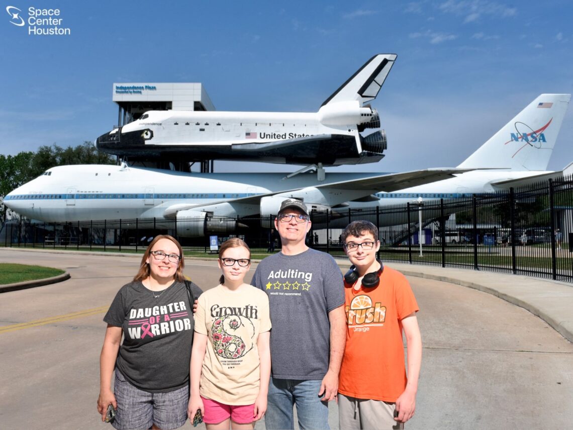 Family in front of NASA jets.