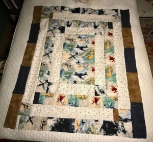 Quilt made with airplane fabric.