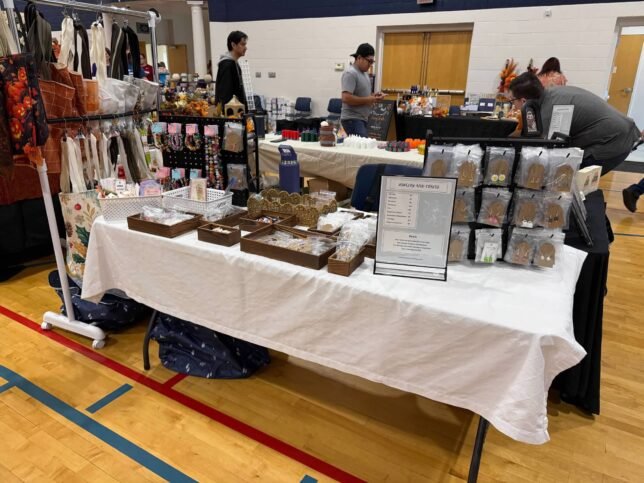 Booth at craft event showing jewelry.