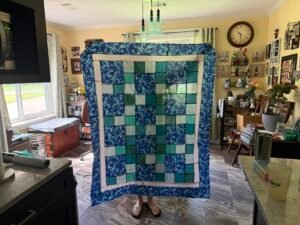 Quilt top made with mermaid and blue patterned fabric