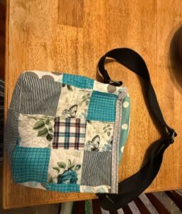 Quilted blue and white purse.